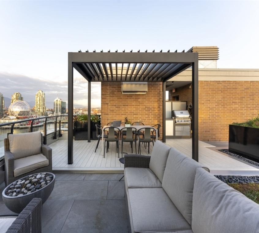 black louvred aluminum pergola on a patio