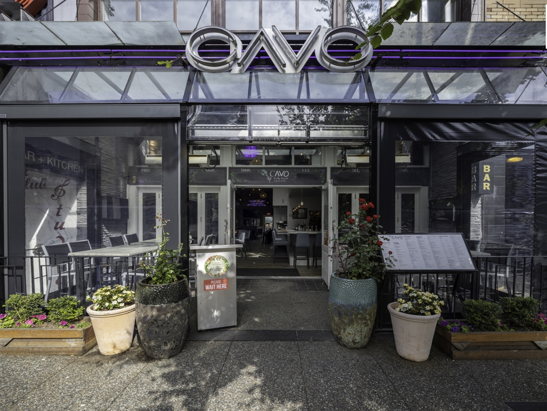 A restaurant patio enclosed with motorized screens