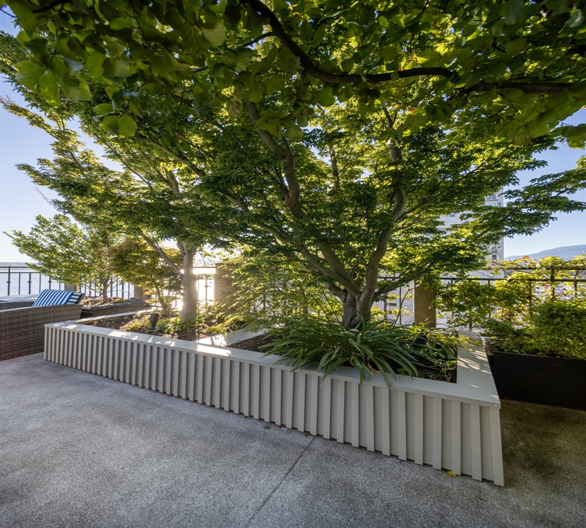 A large planter covered with modern cladding