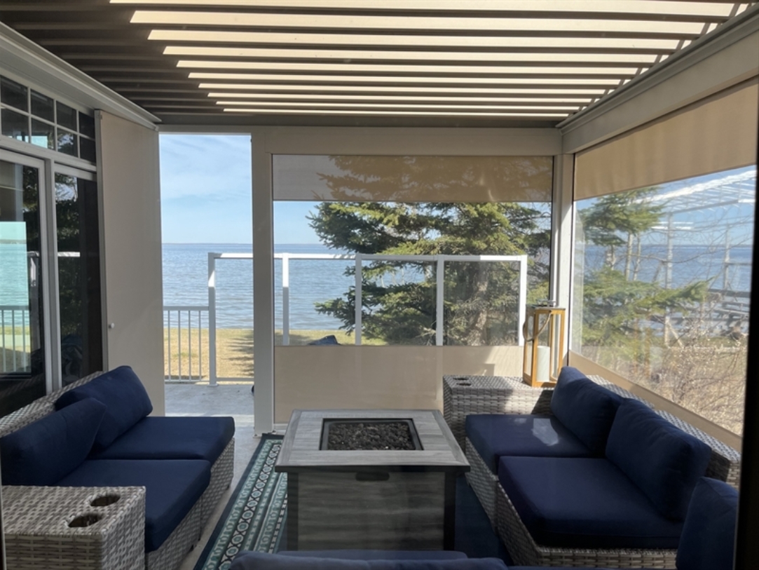 Underneath A White Pergola With Screens