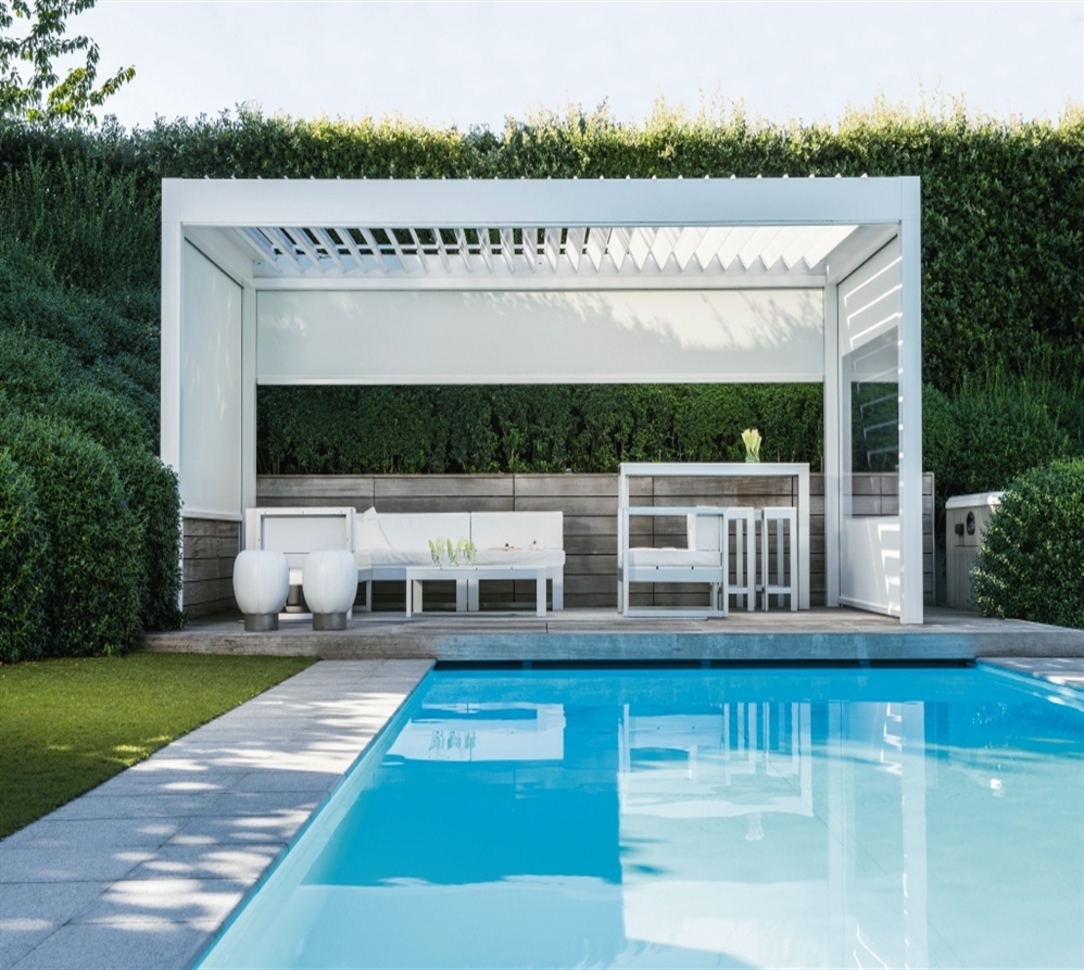 white louvered pergola in the daytime poolside with screens