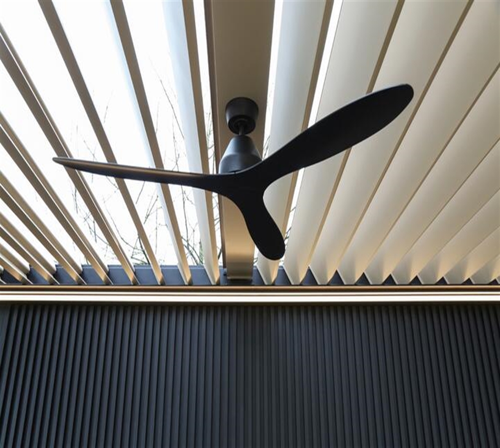 Fixed Louver in a White and Black Pergola With a Mounted Black Fan