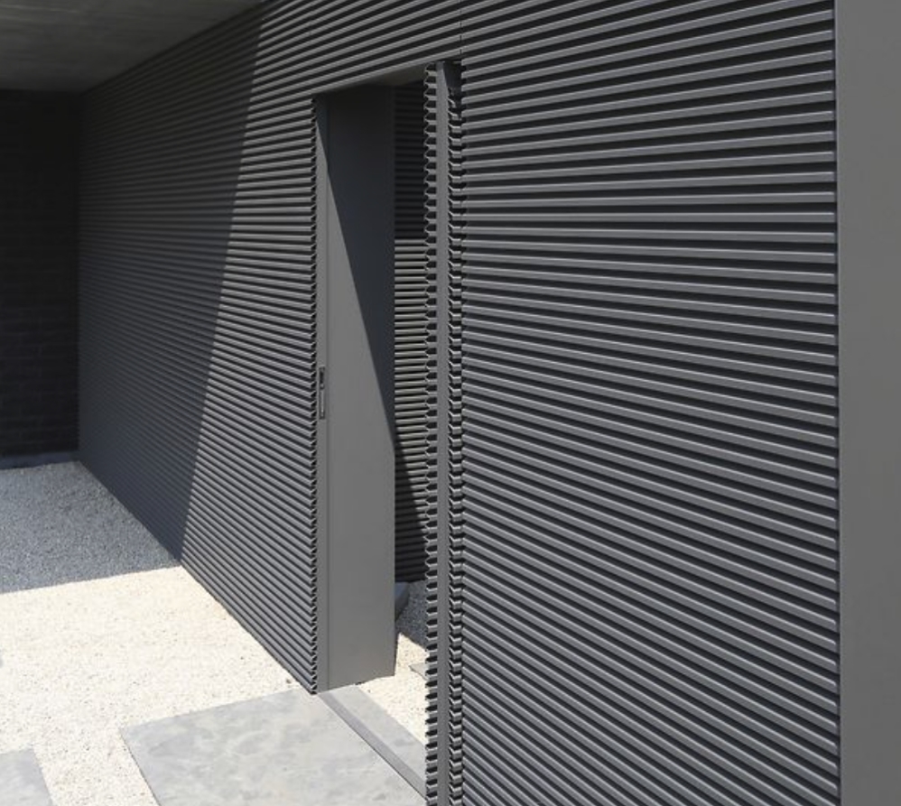 Horizontal wall cladding made of aluminum in grey on a building