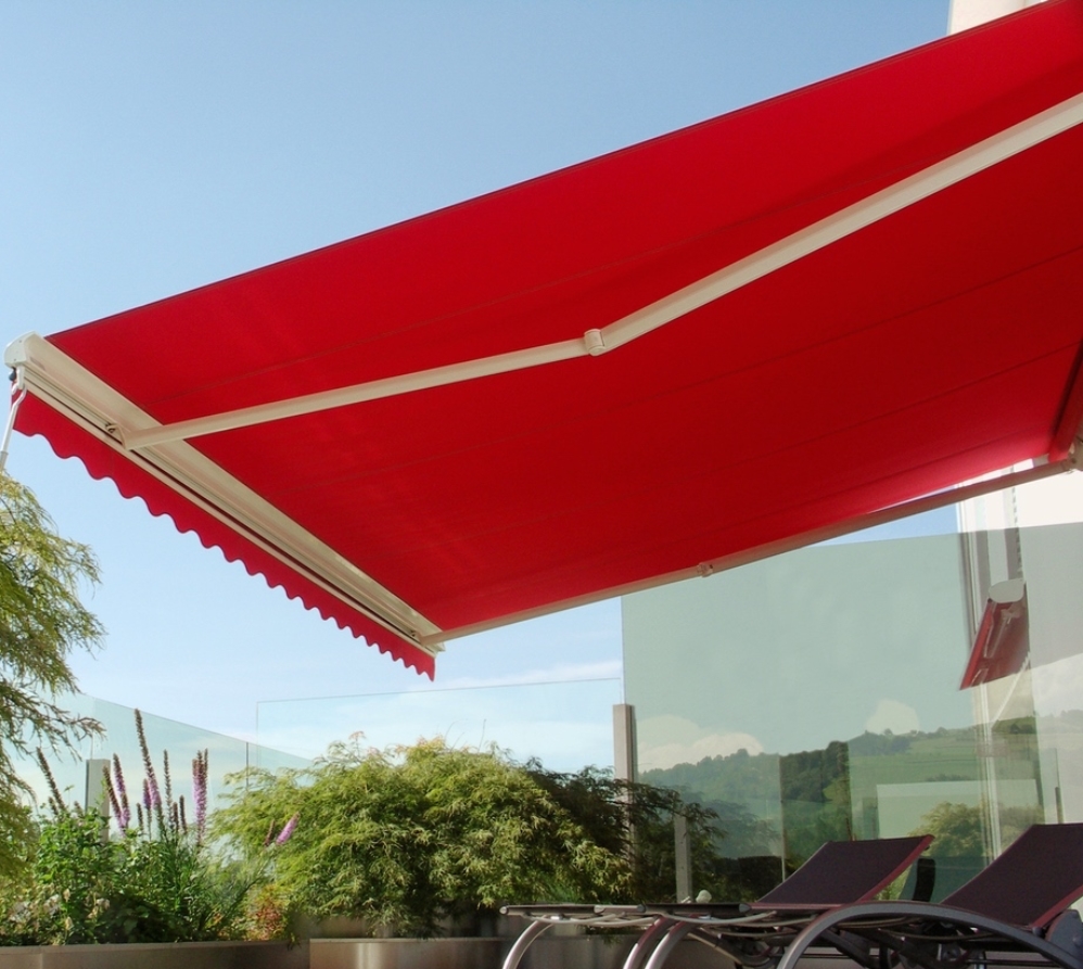 bright red fabric retractable awning attached to a home