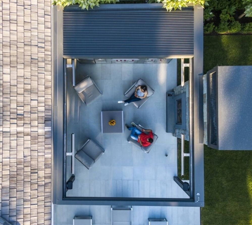 grey retractable canopy system in daytime with heaters and lighting grey retractable canopy system in daytime with heaters and lighting