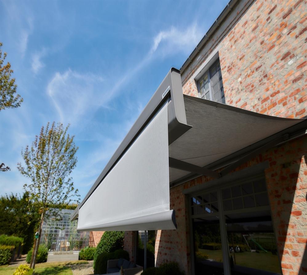 Close-up view of a modern retractable awning with a vertical drop-down valance